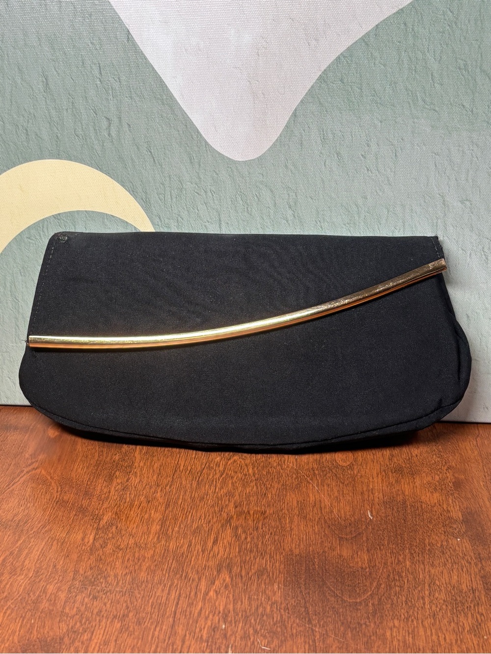 Majestic Black Clutch with Gold Accent Bar